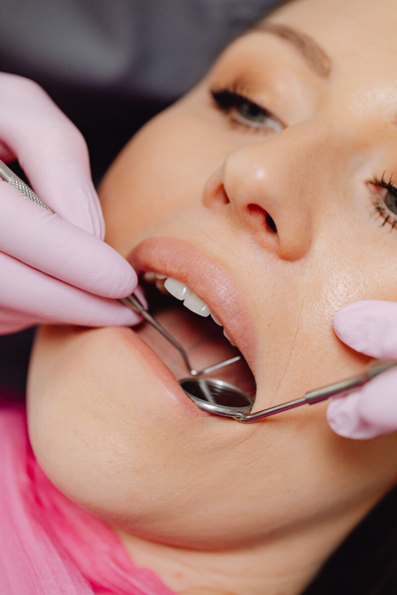 http://Dental%20checkup%20with%20tools%20in%20a%20patient's%20mouth%20for%20hygiene%20procedure.